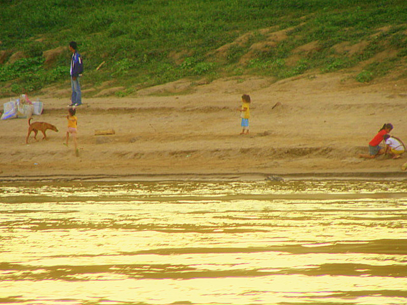 Family on river banks