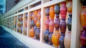 Lines of colourful pots