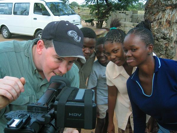 miles showing the Swazis their video