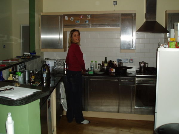 Sharon in the kitchen in Mark's flat