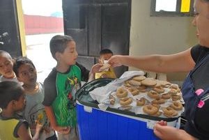 A boy getting a cookie