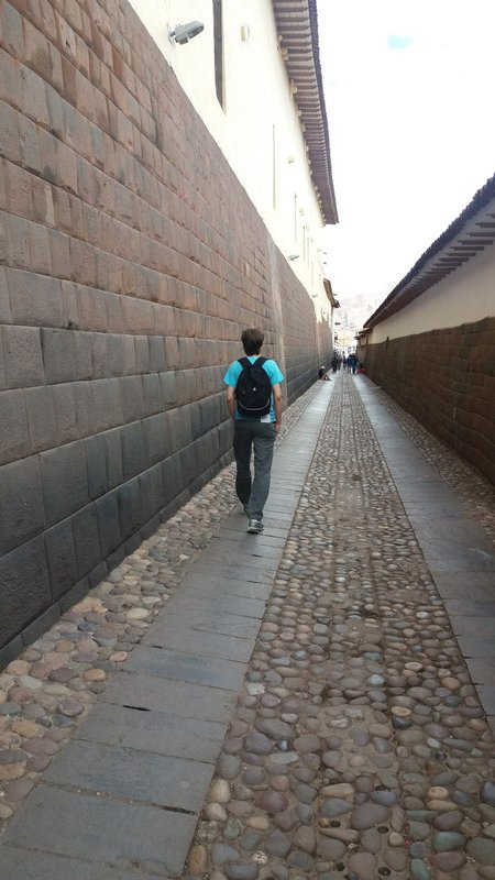 Martin walking next to an Inca wall