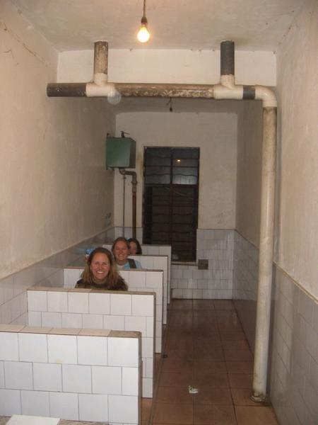 Three girls on a toilet, somewhere in China