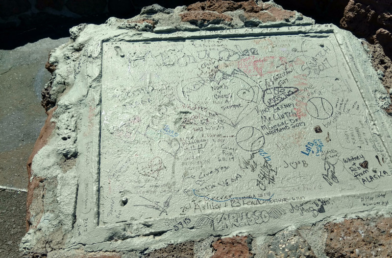 Some jerk pried off the plaques and replaced them with grafitti.