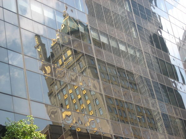 The Crown Building reflected in the Bootleg Building