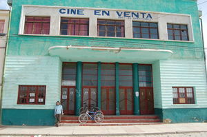 Paula outside the old cinema in salar border-town Uyuni