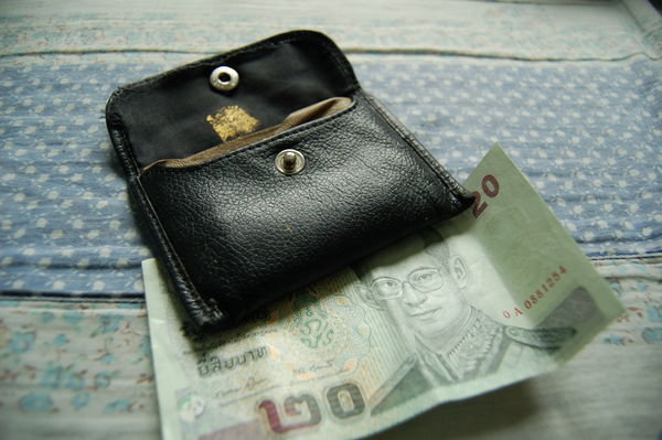 Nick's wallet with small square gold leaf remnant