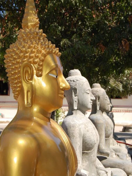Buddha statues at various stages of service