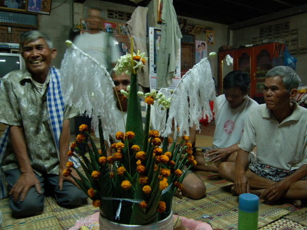 Friends gather round tree decoration for [i]bacii[/i] ceremony
