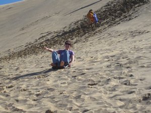 Sledging down sand dunes
