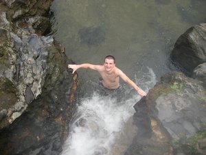 Nick braves the threshold between naturally hot and cold river water!