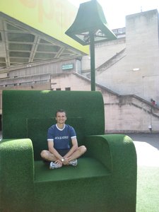 Astro turf art: Nick checks out the armchair for comfort