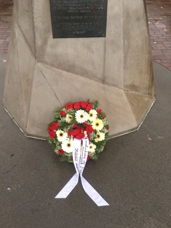 A wreath at the base of the Statue