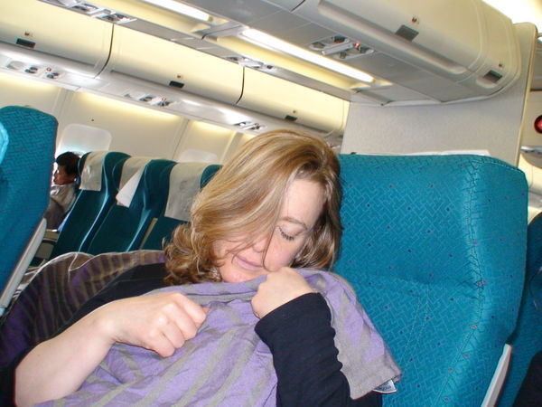 Caroline asleep on plane