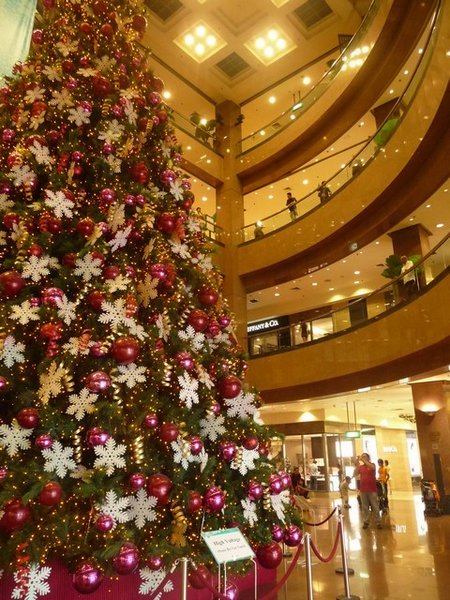 Flashy xmas tree in flashy shopping mall