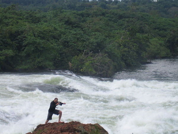 Leaping over rocks at Bujagali Falls