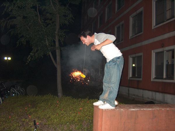 Ryan hanging a firework from his teeth