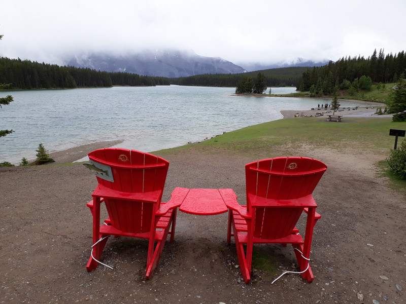 Red chairs at Two Jack Lake