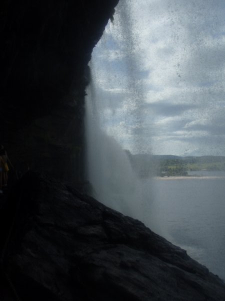 behind the waterfall