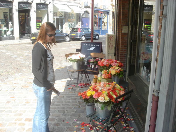 Ange admiring the roses for sale