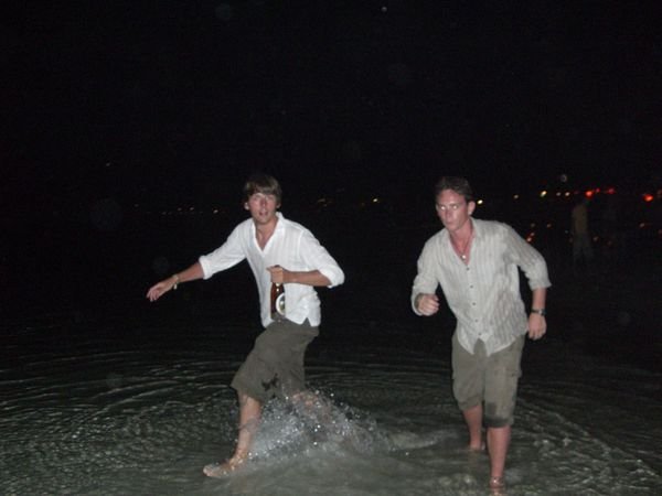 Dancing and drinking in the sea in the early hours