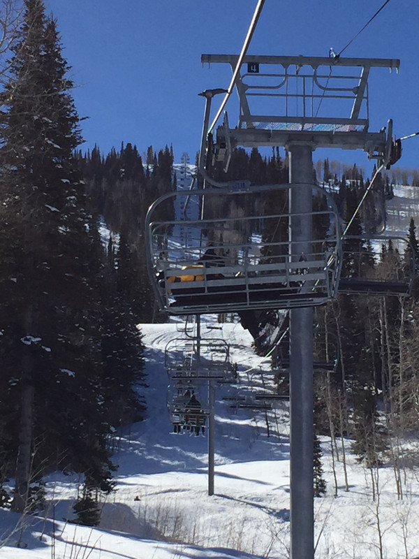 The only way to ride a footrest-less chairlift