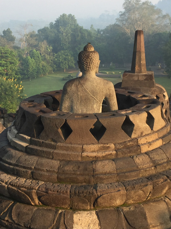 Buddha in open stupa