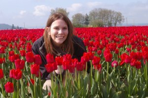 Crouching in Red Tulips