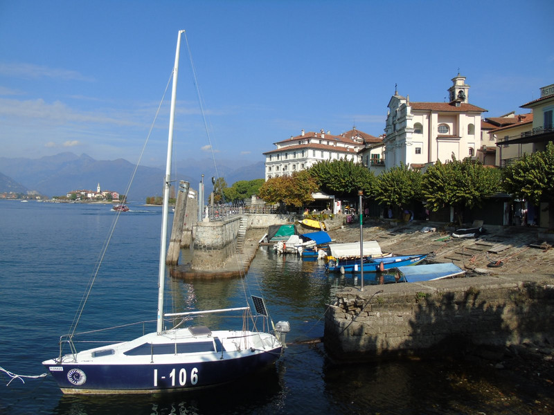 But round the corner is a pleasant view of its church, harbour and palace with Isola Superiore in the background