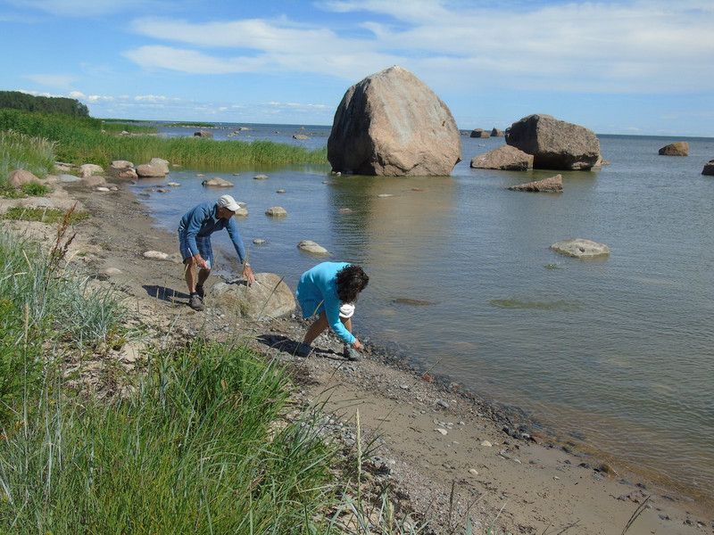 Kevin and Nurcan skimming stones amongst the Erratic Boulders