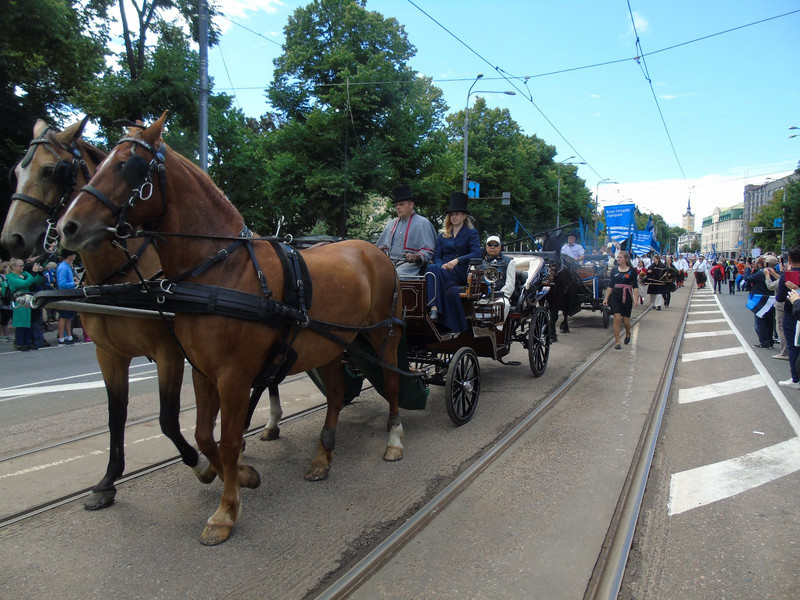 The procession headed by three carriages