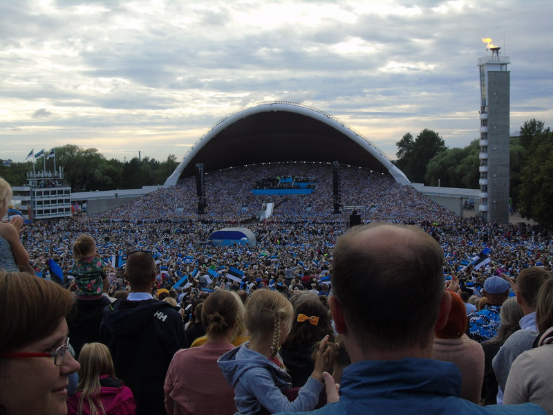 Then even more appeared for the finale until there was little gap between choir and audience. After each song there were huge cheers and everyone excitingly waved their Estonian flags. The flame on the tower to the right was extinguished during the last s