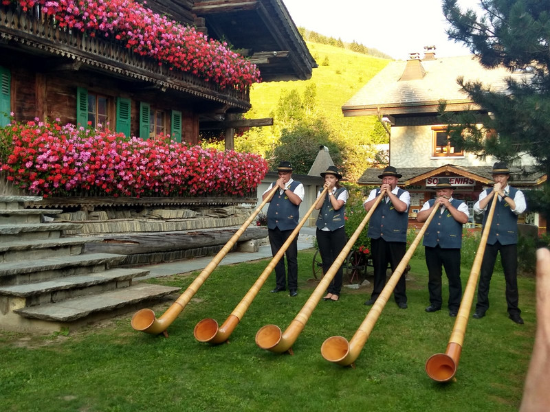 Being entertained by alpine horns during the pre-dinner drinks