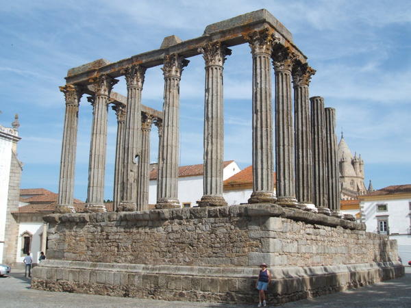 Évora’s roman temple with cathedral spire in the background 