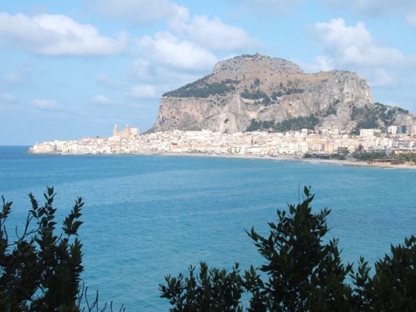 Cefalu sited below its craggy mountain, La Rocca