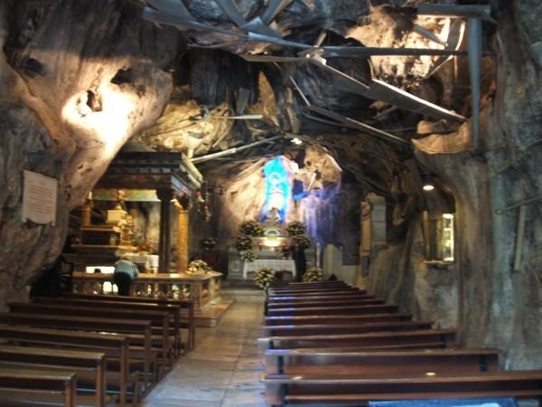 Santuario di Santa Rosalila, a cave where the bones of the city’s patron saint were discovered converted to a chapel. The ironwork is to collect miraculous water