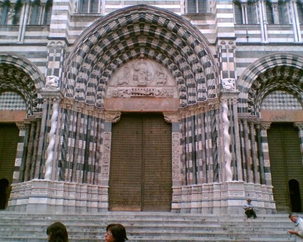 The striped and ornately carved cathedral entrance