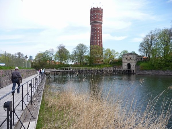 The water surrounding the town centre and the local water tower now converted into flats