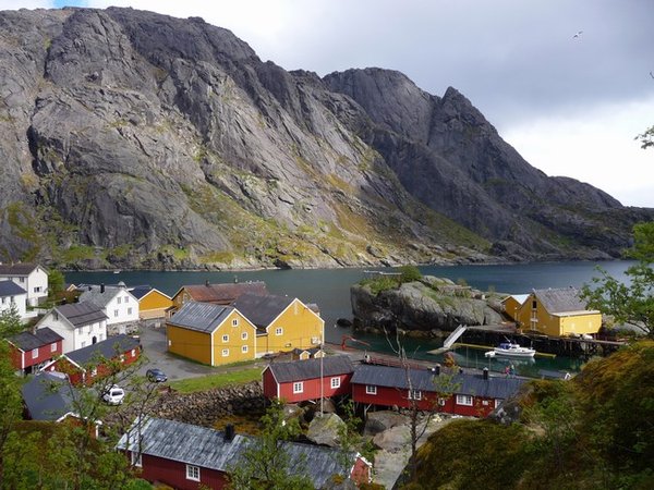 Nustfjord. The small red buildings are called rorbuer, representations of small fishermans shacks which are now used as holiday accommodation