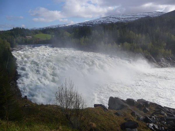 The Laksfossen throwing up clouds of spray