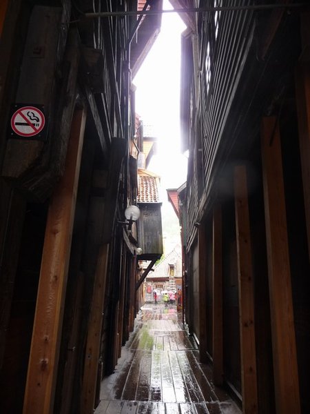 One of the many narrow alleys behind the timber frontages. The no smoking sign is a good idea!