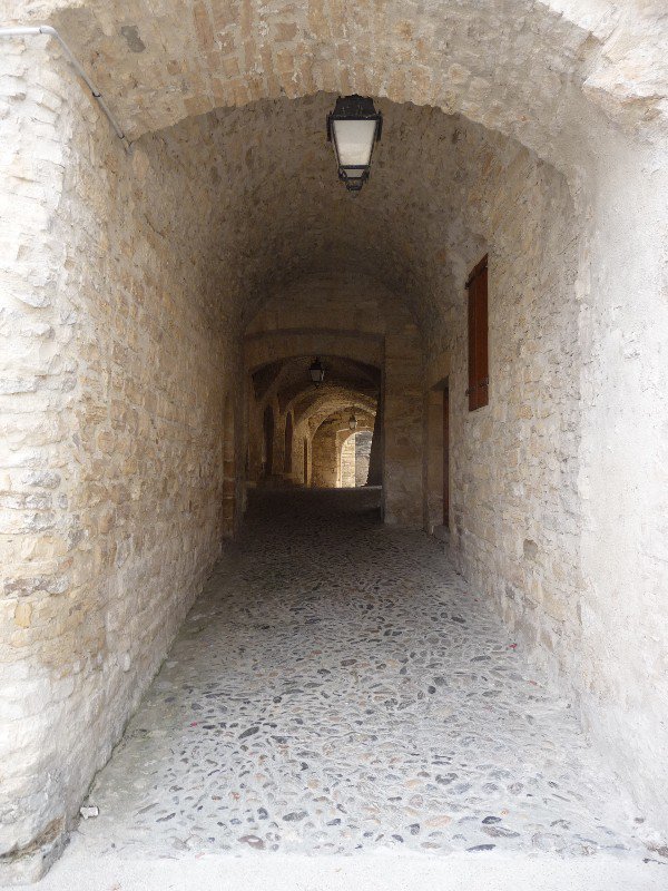 An arched passageway leading to the church