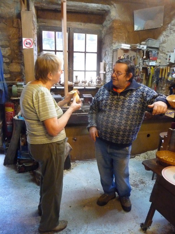 Wendy discussing his work with a fifth generation wood turner. The village is well known for this craft