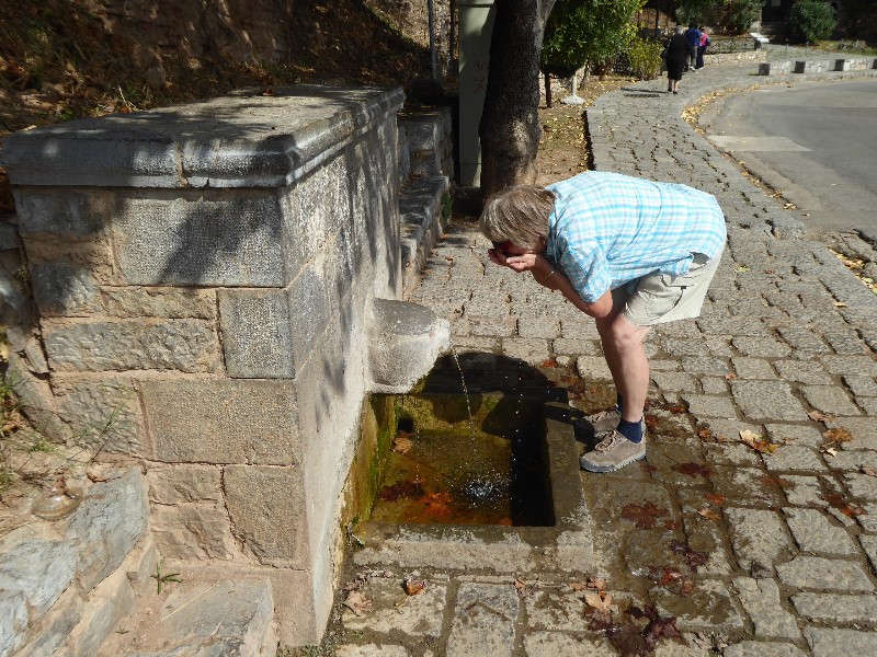 Wendy refreshing herself at the Castalian Spring where pilgrims cleansed themselves before consulting the Oracle