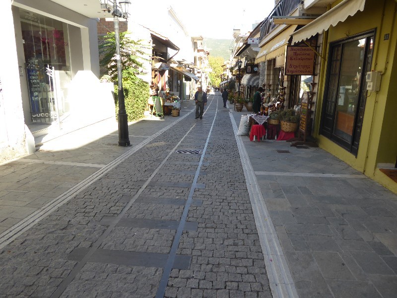 The cobbles in the main street of Vouraikos include a representation of the railway lines