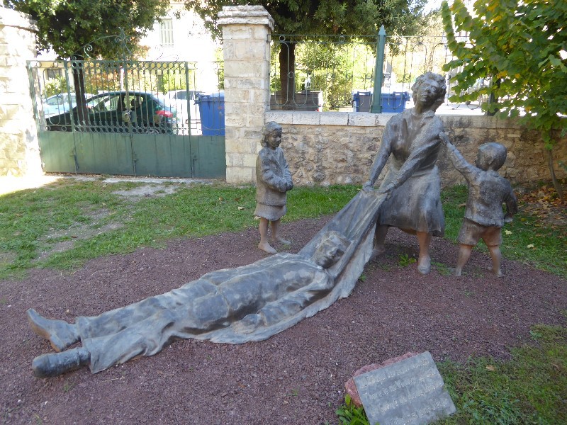 This statue records the fact that the women of the town were left by the Germans to bury the dead