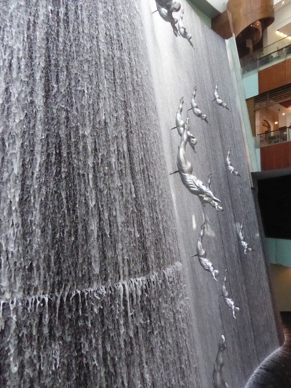 There’s an indoor waterfall with diving statues the full four floor height