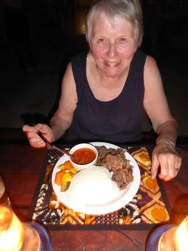 Wendy with her Botswanan supper of goat and ground maize