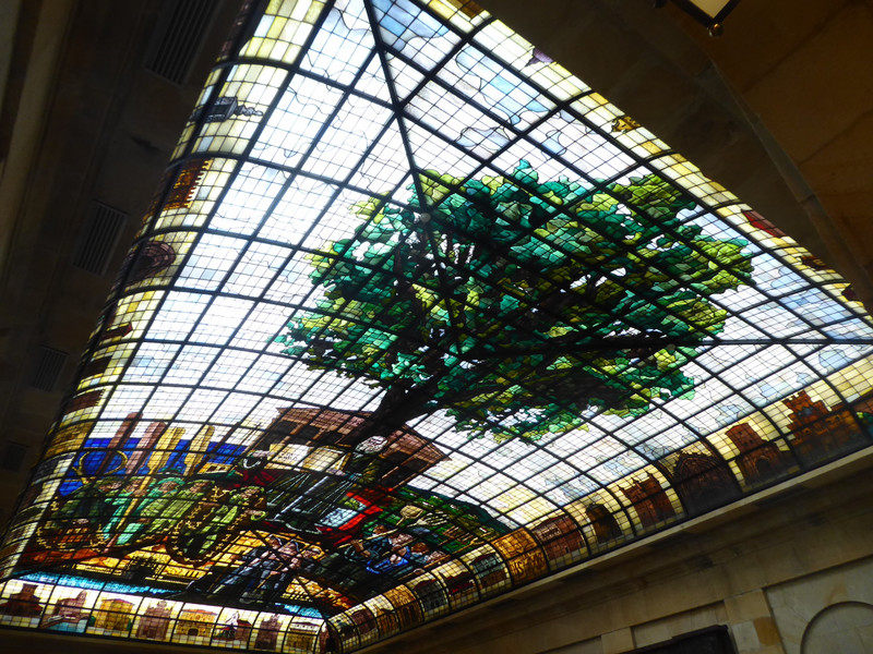 Another area has a huge stained glass roof light which depicts the symbolism of the tree as a meeting place