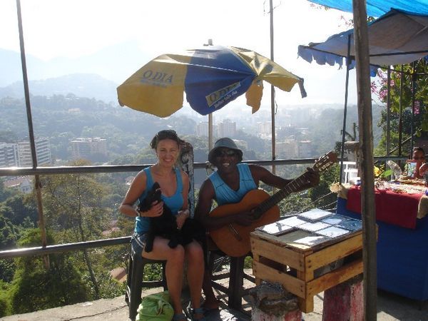 Helen with another one of her dog friends and his musicain owner, Rocinha favela